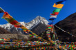 Mount Gongga (also known as Minya Konka) - Gongga Shan in Sichuan Province, China. Tibetan Prayer Flags with Sacred Snow Mountain in the background. Himalayas, Highest Mountain in Sichuan Province