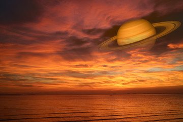 Wall Mural - Saturn back night cloud sunset sky on sea ,concept Saturn near Earth