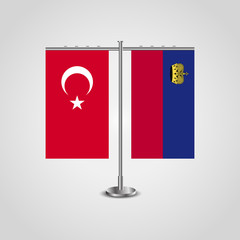 Table stand with flags of Turkey and Liechtenstein.Two flag. Flag pole. Symbolizing the cooperation between the two countries. Table flags