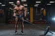 © antondotsenko - Brutal strong bodybuilder athletic men pumping up muscles with dumbbells