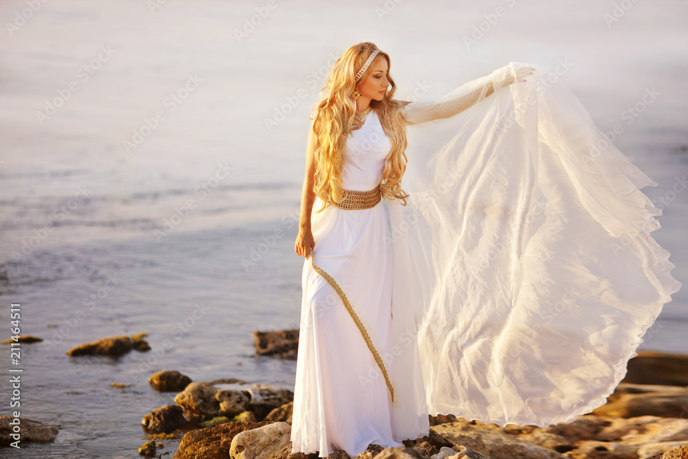 Beautiful girl in a long white wedding dress in Greek style is the old Greek  goddess Stock Photo | Adobe Stock