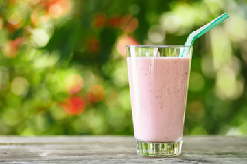 Sticker - pink milkshake in glass on table