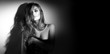© Subbotina Anna - Sexy young woman black and white portrait. Seductive young woman with long hair posing in spotlight. Wide angle