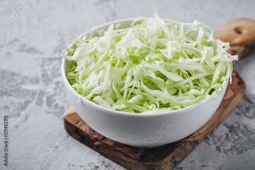 Fresh green cabbage cut. Sliced cabbage in bowl Poster Mural XXL