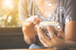 Asian woman hand using smartphone with icon technology artificial intelligence (AI) and internet of things (IOT)