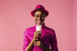 © Carlos David - Smiling woman looking down at glass of milk