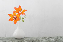Orange Lily In Vase On White Background