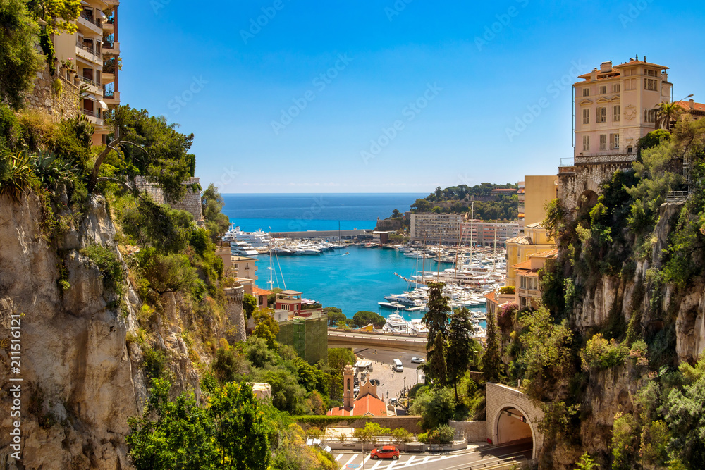 Obraz na płótnie View of Monaco City with boat marina below in Monaco. Monaco City is one of the four traditional quarters. w salonie