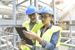 © goodluz - Industrial engineers working in recycling plant with tablet