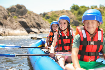 Wall Mural - little children kayaking on river. summer camp