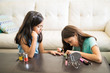 © AntonioDiaz - Elder sister applying nail color on younger sister nails