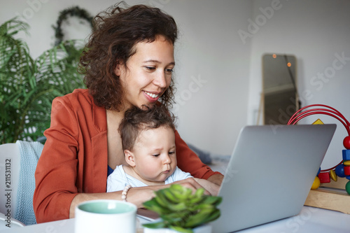 Beautiful Young Woman Freelancer Working Distantly Using Laptop