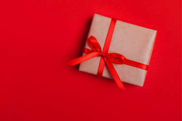 Wall Mural - Present box with red bow on colorful background