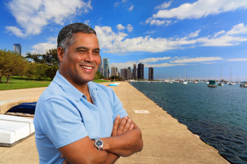 Wall Mural - Handsome Hispanic man in a downtown urban waterfront setting