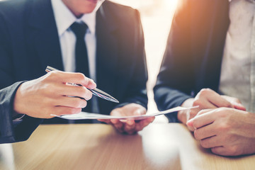 business people meeting negotiating a contract between two colleagues