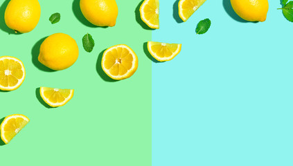 Wall Mural - Fresh lemon pattern on a bright color background flat lay