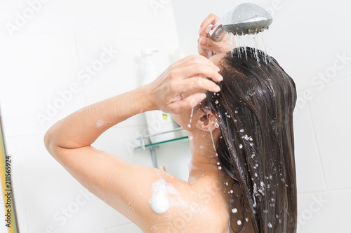Fotografie, Obraz Woman in shower washing hair with shampoo.