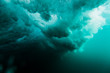 Breaking ocean wave is underwater. Blue ocean in underwater