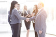 © yurolaitsalbert - handshake of a businessman and business woman