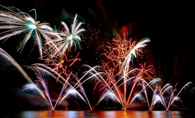 Brightly Colorful Fireworks shot over the sea