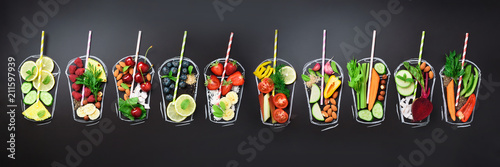 Fotografía Food ingredients for blending smoothie or juice on painted glass over black chalkboard