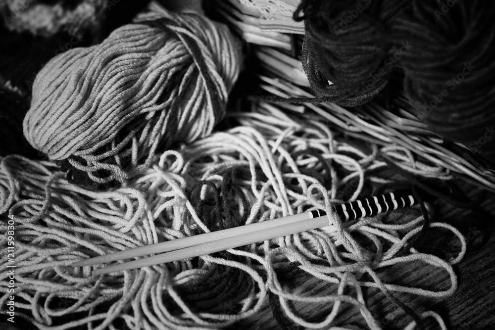 monochrome wool and knitting needles - obrazy, fototapety, plakaty 