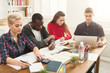 © Prostock-studio - Group of diverse students studying at wooden table