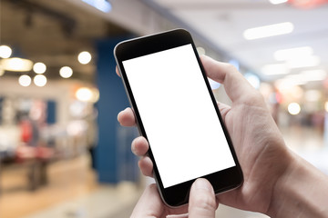 Woman hand holding smartphone in cafe. Blank screen mobile phone for graphic display montage