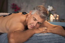 Senior Man Resting With Hot Stone Massage
