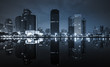 scenic of dark night cityscape and mirror on water