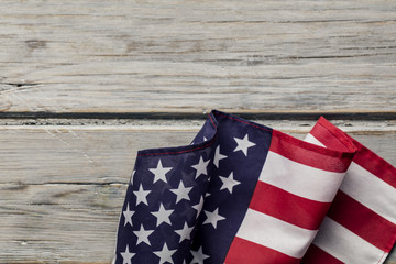 American stars and stripes flag on a white wooden plank background