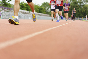 Group of people running race marathon