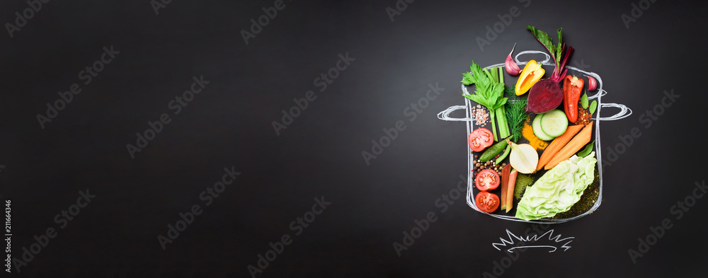 Food ingredients for blending creamy soup on painted stewpan over black chalkboard. Top view with copy space. Organic vegetables, spices, herbs. Vegetarian, vegan, detox, clean eating concept - obrazy, fototapety, plakaty 