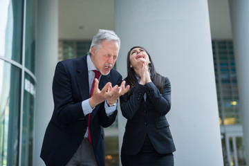 Angry and desperate business people arguing with each other