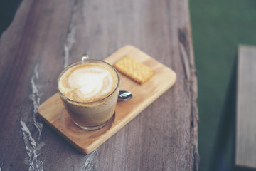 Coffee cup in coffee shop - vintage style effect picture