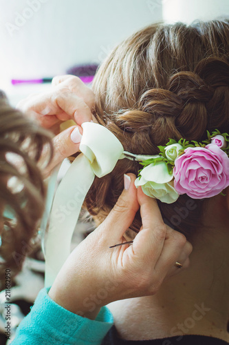 Beautiful Girl Hairdresser Weaves A Braid Close Up In A Beauty