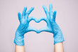 © Svetlana - Hand in blue medical glove with Heart symbol isolated on white background