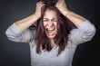© Teodor Lazarev - Frustrated angry woman screaming and pulling her hair, young woman angry