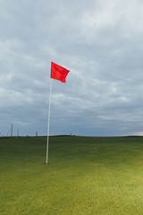 Wall Mural - golf course and red pin flag