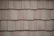 tan staggered shake siding construction exterior