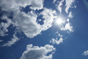 white Cumulus clouds on a blue sky background