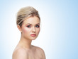 © Acronym - Portrait of attractive girl with smooth skin and beautiful blue eyes.