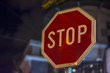 © bennian_1 - Stop street night sign STOP on rod in the city