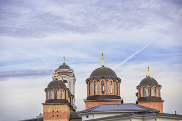 Top of holy orthodox church architecture with blu cloudy sky in the city