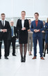 © ASDF - confident business woman standing in front of his business team.
