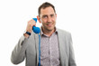© Catalin Pop - Portrait of business man talking on blue receiver telephone