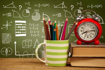 Poster - Composite image of books with alarm clock by colored pencils in