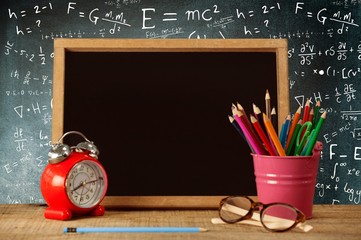 Leinwandbilder - Composite image of slate with desk organizer and alarm clock by