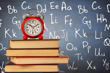 Poster - Composite image of old alarm clock and stack of books