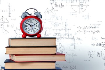 Wall Mural - Old alarm clock and stack of books